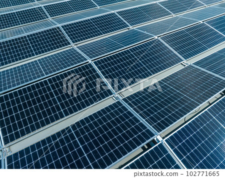 Close-up of Solar cell farm power plant eco technology. Landscape of Solar cell panels in a photovoltaic power plant. Concept of sustainable resources and renewable energy.blue tone. Close-up of Solar cell farm power plant eco technology. Landscape of Solar cell panels in a photovoltaic power plant. Concept of sustainable resources and renewable energy.blue tone. 102771665