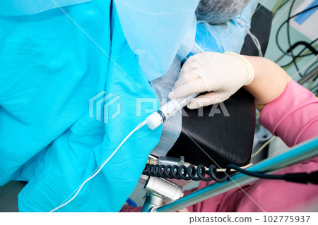 Syringe with anesthesia in the doctor's hand. 102775937