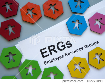 Colorful figurines and papers about Employee Resource Groups ERGs. 102779099