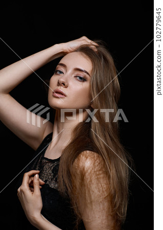 gorgeous brunette woman with long hair in black dress gorgeous brunette woman with long hair in black dress 102779645