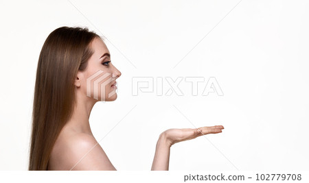 woman holding on open arm copy space on white background. 102779708