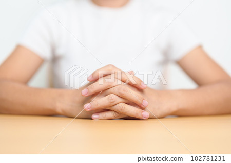 Woman holding hands on table. Business, Thinking, Decision, logical and vision concepts Woman holding hands on table. Business, Thinking, Decision, logical and vision concepts 102781231