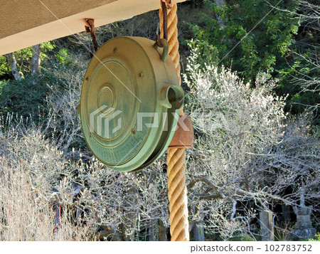 Round copper Waniguchi hanging in front of shrines and temples 102783752