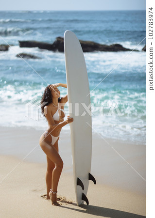 Ready for Surfing: Stylish Beach Photo of Bikini Female Model Ready for Surfing: Stylish Beach Photo of Bikini Female Model 102783974