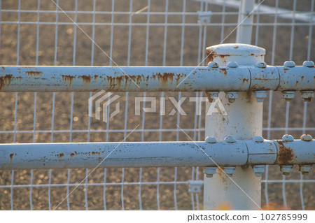 An old rusty guardrail that protects pedestrians An old rusty guardrail that protects pedestrians 102785999