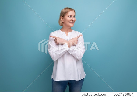 healthy slim blond mature woman smiling on studio background healthy slim blond mature woman smiling on studio background 102786094