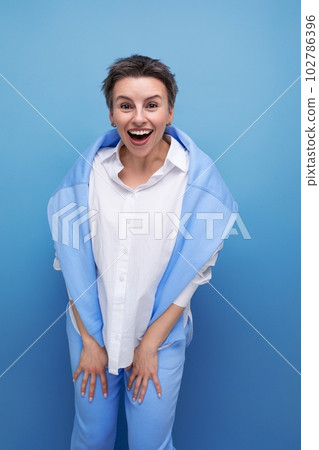 close-up portrait of a charismatic short-haired lady in a casual shirt close-up portrait of a charismatic short-haired lady in a casual shirt 102786396