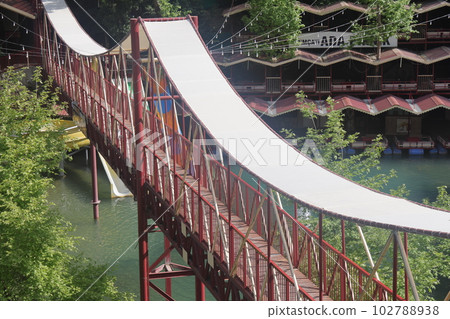 Pedestrian bridge across the Dimchay river gorge, picnic and cafe area, Alanya, Turkey, April 2023. Pedestrian bridge across the Dimchay river gorge, picnic and cafe area, Alanya, Turkey, April 2023. 102788938