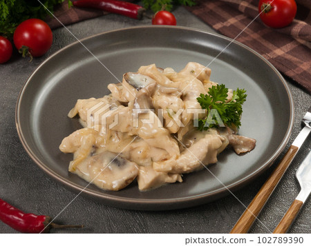 gentle chicken fricassee in cream with mushrooms gentle chicken fricassee in cream with mushrooms 102789390