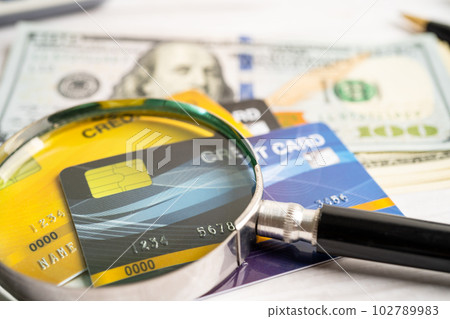 Credit card and US dollar banknotes money, finance concept. Credit card and US dollar banknotes money, finance concept. 102789983