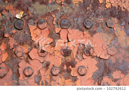 Old flaked red paint 102792612