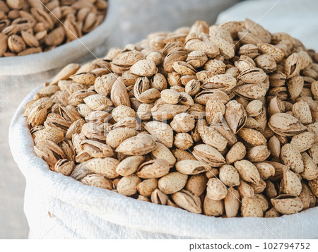 Bags and bowls with fragrant spices lying in the market 102794752