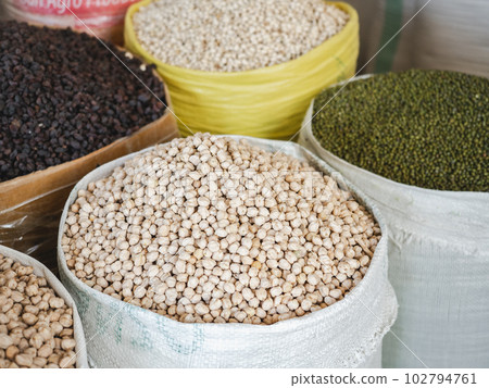 Bags and bowls with fragrant spices lying in the market 102794761