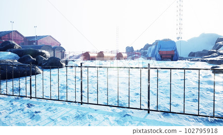 Polar weather station on the shore of the sea 102795918