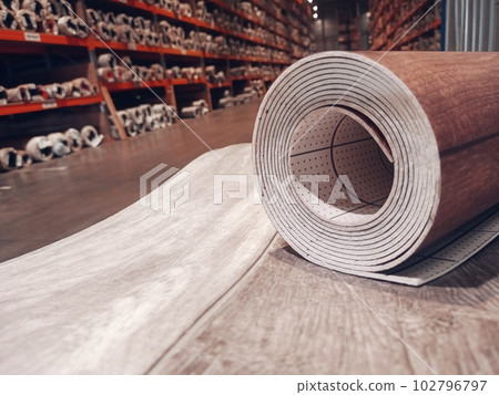 Linoleum. A roll of linoleum is in the flooring warehouse.  102796797