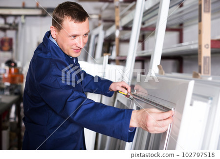 Production worker with PVC windows 102797518