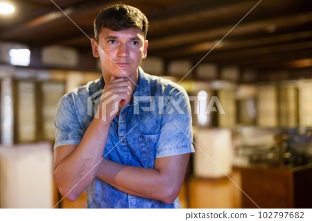 Man looking at exhibit on exposition Man looking at exhibit on exposition 102797682