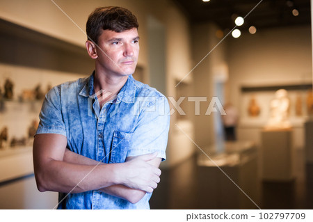 Man looking at exhibit on exposition Man looking at exhibit on exposition 102797709