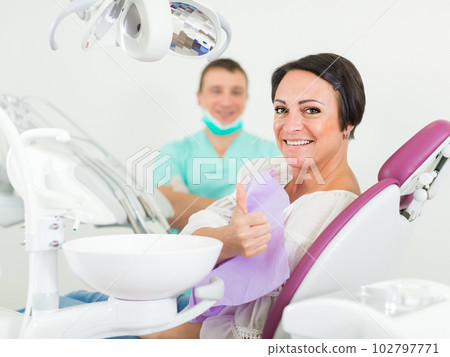 woman in medical center thumbs up woman in medical center thumbs up 102797771