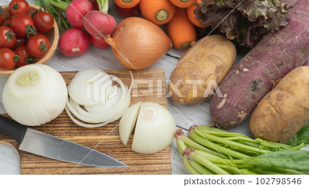 many vegetables on the table 102798546