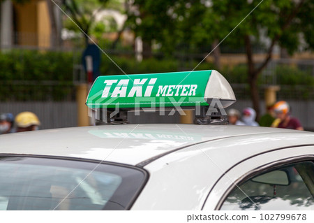 Green Vietnamese taxi meter sign Green Vietnamese taxi meter sign 102799678
