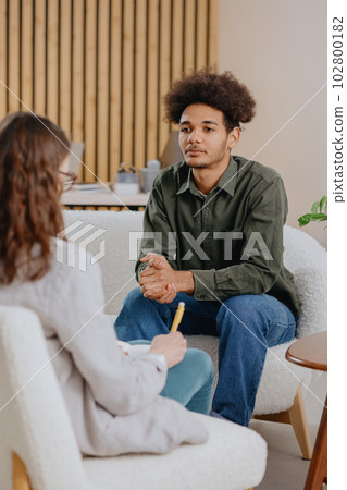 young man in consultation with psychologist is taking care of mental health. young man in consultation with psychologist is taking care of mental health. 102800182