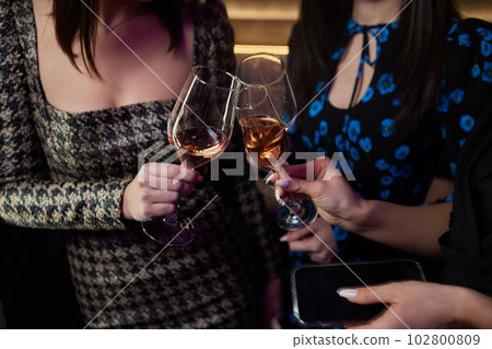 Clinking glasses with alcohol and toasting, party. Clinking glasses with alcohol and toasting, party. 102800809