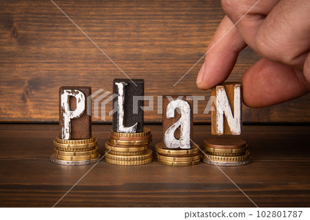 Plan Concept. Change and alphabet blocks on wood texture background 102801787