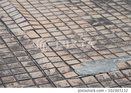 Outdoor passage: Damaged tile Outdoor passage: Damaged tile 102803132