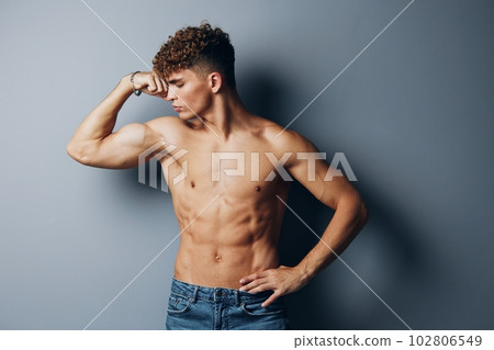 man shirtless fitness guy person abs beauty studio standing sport gray background care man shirtless fitness guy person abs beauty studio standing sport gray background care 102806549