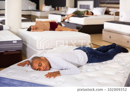 Ordinary man fell asleep on new mattress Ordinary man fell asleep on new mattress 102809352