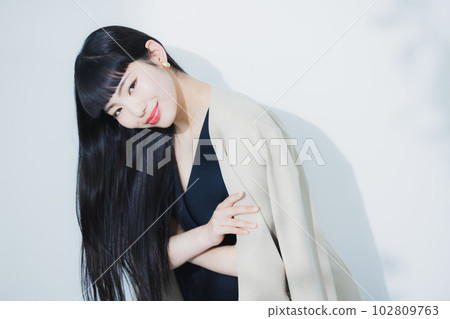 woman blowing her hair 102809763