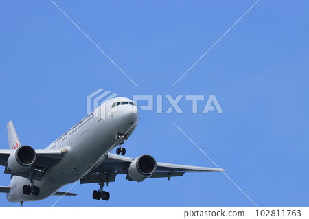Air travel Passenger plane rising into the blue sky 102811763