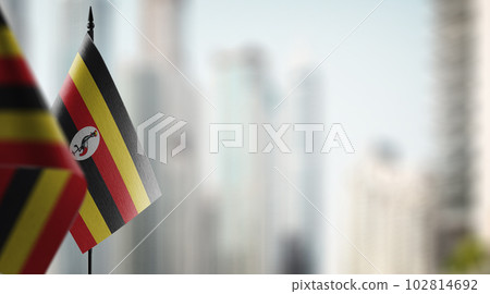 Small flags of the Uganda on an abstract blurry background 102814692