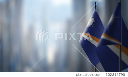 Small flags of the Marshall on an abstract blurry background Small flags of the Marshall on an abstract blurry background 102814790