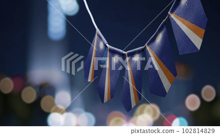 A garland of Marshall national flags on an abstract blurred background A garland of Marshall national flags on an abstract blurred background 102814829