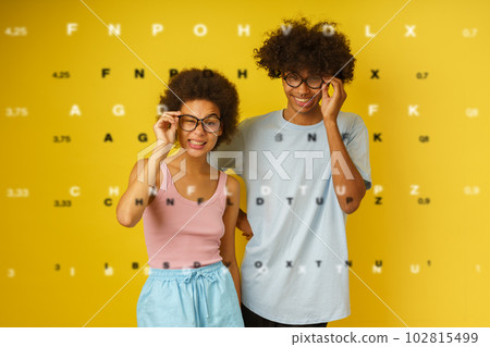 Funny couple has vision problem with the glasses 102815499
