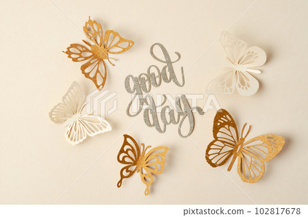 The Good day text with butterfly paper carve on pastel background. 102817678