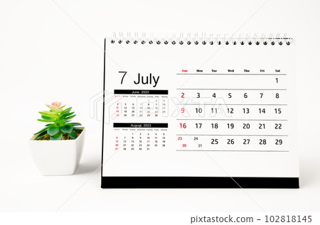 The July 2023 Monthly desk calendar for 2023 year with plant pot isolated on white background. The July 2023 Monthly desk calendar for 2023 year with plant pot isolated on white background. 102818145