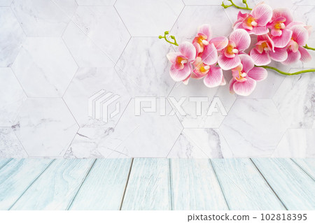 The Wooden floor and marble wall with pink color orchid decorate, empty room for background. The Wooden floor and marble wall with pink color orchid decorate, empty room for background. 102818395