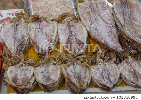 Closeup of deep fresh sun dried squid - Traditional vietnamese cuisine in Dam market, Nha Trang city 102818985