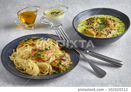 Fried poultry chicken baked with garlic and herbs in milk cream and noodles 102820512