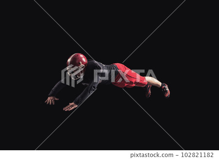Football player on dark background Football player on dark background 102821182