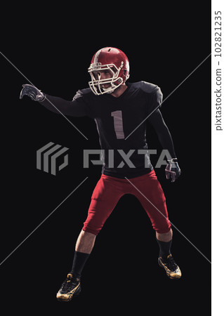 Football player on dark background 102821235