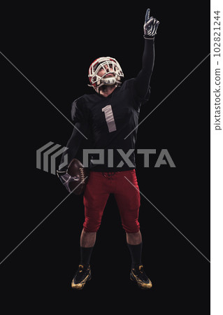 Football player on dark background Football player on dark background 102821244