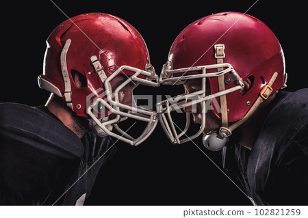 Football player on dark background Football player on dark background 102821259