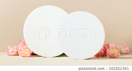 Abstract geometric pedestals and pink tulips on beige background Abstract geometric pedestals and pink tulips on beige background 102822361