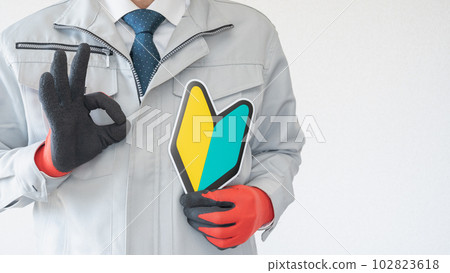 Beginner mark and man in work clothes OK pose Beginner mark and man in work clothes OK pose 102823618