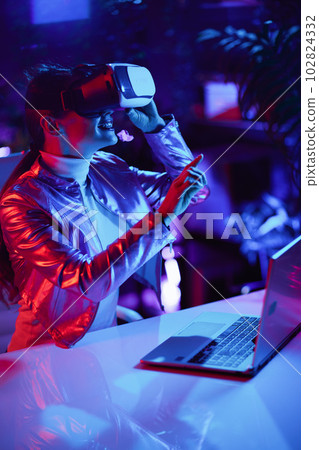 happy trendy woman in vr headset in modern office happy trendy woman in vr headset in modern office 102824332
