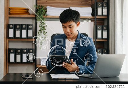 businessman hand working with mobile phone and modern compute with VR icon diagram at office in morning light businessman hand working with mobile phone and modern compute with VR icon diagram at office in morning light 102824711